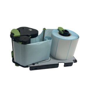 A thermal printer label roll assembly with green clips and guides, holding a large roll of blank labels for printing